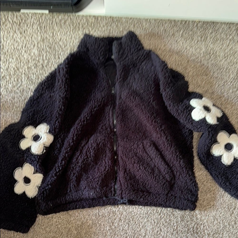 Black Fleece Jacket with White Flower Accents